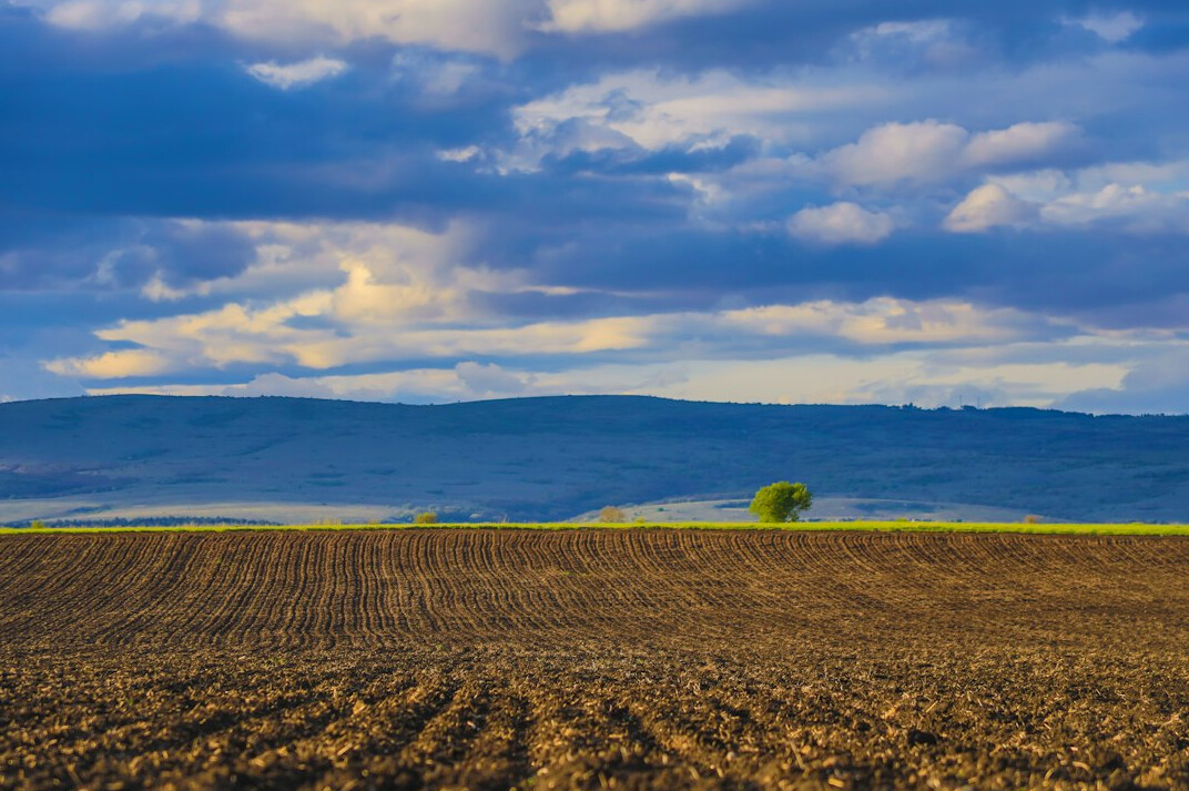 Green rolling hills and countryside landscape